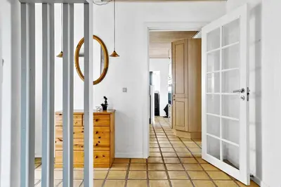 a hallway with a door leading to a room with white walls at 264-Vestervig-Krik-Strandvej-20 in Vestervig
