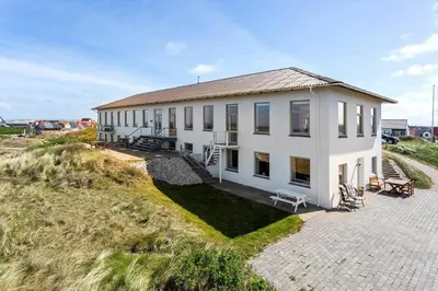 a white building on the side of a beach at 303-Thisted-Hotelvej-5-F in Thisted