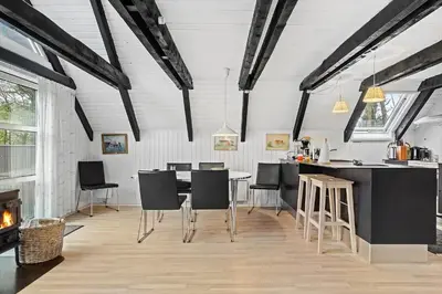 a kitchen and dining room with a table and chairs at 621-Thisted-Molgaardsvej-21 in Thisted