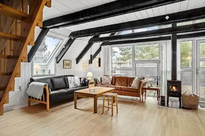a living room with a couch and a table at 621-Thisted-Molgaardsvej-21 in Thisted