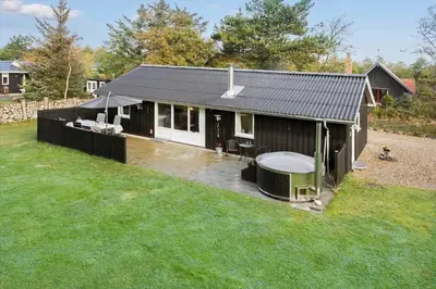 a small house with a gazebo in a yard at 1310-Vestervig-Rorsangervej-3 in Vestervig