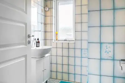 a bathroom with a sink and a window at 110-Vestervig-Svanholmvej-10 in Vestervig