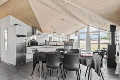a kitchen and dining room with a table and chairs at 433-Thisted-Tunvej-20 in Thisted