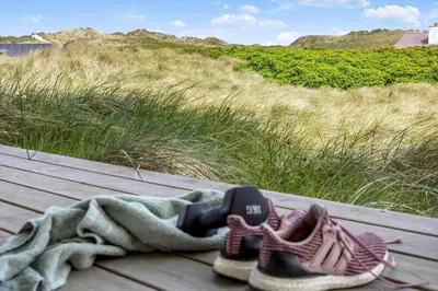 a pair of shoes and a blanket sitting on a table at 915-Thisted-P-Bolesens-Vej-11 in Torsted