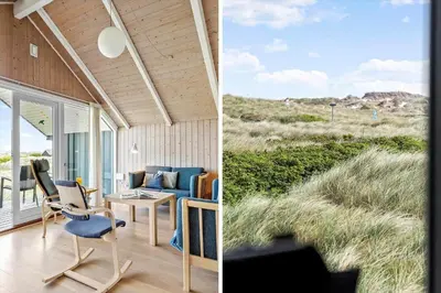 a house with a view of the desert and a table and chairs at 915-Thisted-P-Bolesens-Vej-11 in Torsted