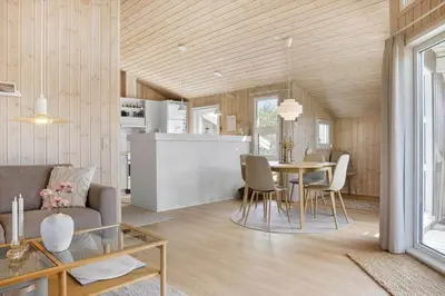 a living room and kitchen with a table and chairs at 211-Vestervig-Rylevej-1 in Vestervig