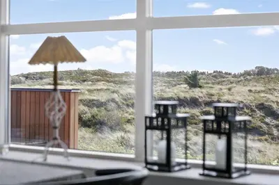 a room with a window with a giraffe figurine on a counter at 643-Thisted-Bredkaervej-69-A in Thisted