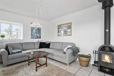 a living room with a couch and a fireplace at 643-Thisted-Bredkaervej-69-A in Thisted