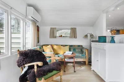 a living room with a couch and a table at 114-Thisted-Tunvej-14 in Thisted