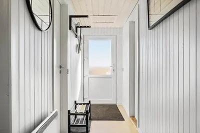 a hallway with a bench and a window at 132-Thisted-Sotungevej-31 in Thisted