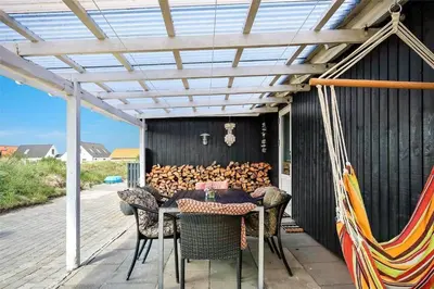 a patio with a table and chairs under a pergola at 635-Thisted-Store-Knuds-Vej-6 in Thisted