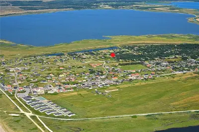 an aerial view of a parking lot next to a body of water at 140-Vestervig-Bekkasinvej-14 in Vestervig