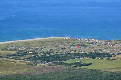 an aerial view of a small town next to the ocean at 939-Thisted-Niels-Vognmands-Vej-3 in Torsted