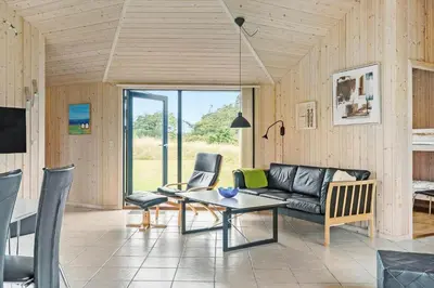a living room with a couch and a table at 939-Thisted-Niels-Vognmands-Vej-3 in Torsted