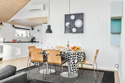 a kitchen and dining room with a table and chairs at 305-Thisted-Fiskervej-35 in Thisted