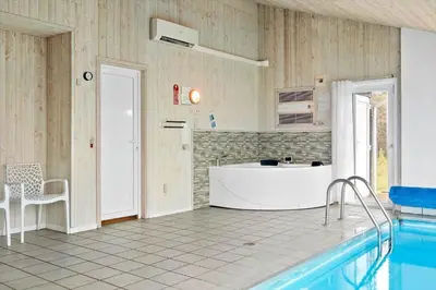 a kitchen with a swimming pool and a tub at 970-Thisted-Klitstien-47 in Torsted