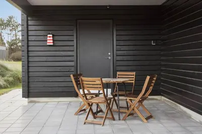 a table and chairs sitting on a patio at 105-Thisted-Gronkaervej-19-B in Thisted