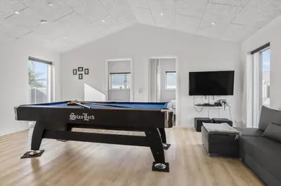 a living room with a pool table and a couch at 105-Thisted-Gronkaervej-19-B in Thisted