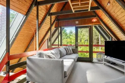 a living room with a couch and a flat screen tv at 216-Snedsted-Grahavrevej-6 in Snedsted