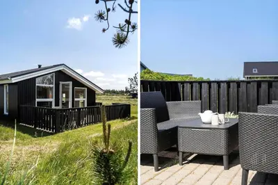 a patio with a table and chairs and a house at 534-Thisted-Fiskervej-123 in Thisted