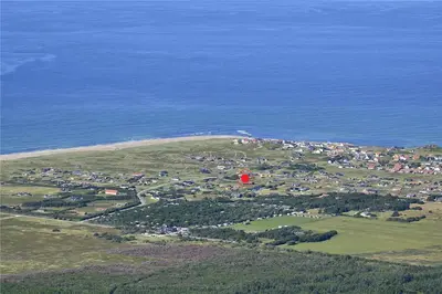 an aerial view of a town on a hill next to the ocean at 962-Thisted-Bavnbak-27 in Torsted