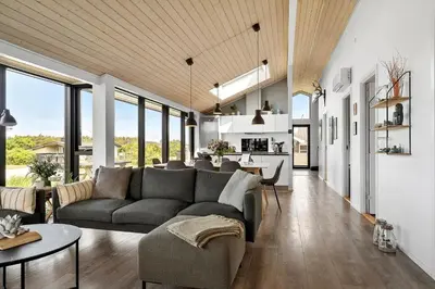 a living room with a couch and a table at 786-Thisted-Flyndervej-6 in Thisted