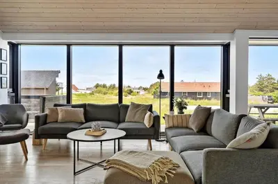 a living room with a couch and a table at 786-Thisted-Flyndervej-6 in Thisted