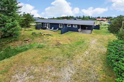 an aerial view of a blue house with a yard at 767-Thisted-Nordsovej-63 in Thisted