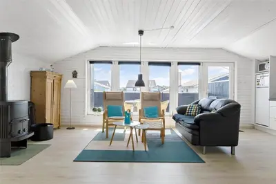 a living room with a couch and a table at 662-Thisted-Havbovej-18 in Thisted