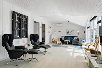 a living room with black chairs and a couch at 662-Thisted-Havbovej-18 in Thisted