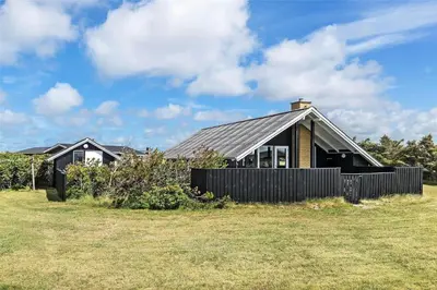 a house with a fence in front of it at 958-Thisted-Kobbelsti-22 in Torsted