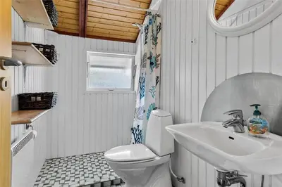 a bathroom with a toilet and a sink at 958-Thisted-Kobbelsti-22 in Torsted