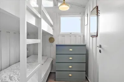 a small bedroom with a bunk bed and a window at 1003-Thisted-Ajs-Molls-Vej-2 in Torsted