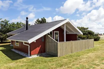a red shed with a metal roof on a field at 715-Thisted-Tunvej-22 in Thisted