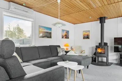 a living room with a couch and a fireplace at 837-Thisted-Flyndervej-17 in Thisted