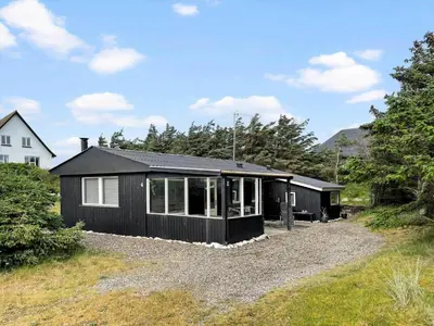 a black house on a gravel driveway at 370-Thisted-Fyrvej-4 in Thisted