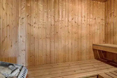 a wooden sauna with a bench and a wooden wall at 100-Thisted-Kapelvej-1 in Thisted