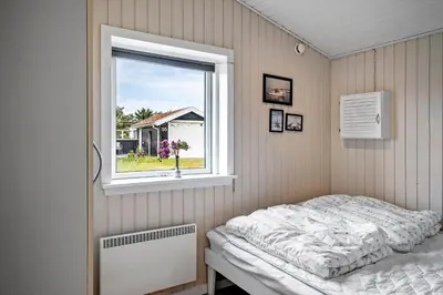 a bedroom with a bed and a window at 514-Thisted-Fiskervej-53 in Thisted