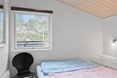 a bedroom with a bed and a window at 746-Thisted-Blamunkevej-36 in Thisted