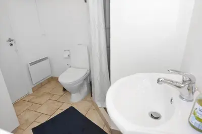 a bathroom with a white sink and a toilet at 746-Thisted-Blamunkevej-36 in Thisted