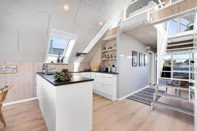a kitchen with white cabinets and a counter top at 842-Thisted-Orredvej-40 in Thisted