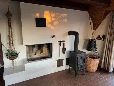 a fireplace in a room with a stove at 875-Thisted-Flyndervej-23 in Thisted