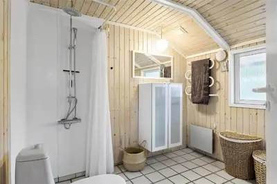 a bathroom with a shower and a toilet in it at 435-Vestervig-Sivsangervej-32 in Vestervig