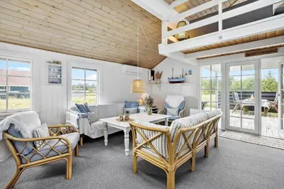 a living room with a table and chairs at 571-Thisted-Tunvej-21 in Thisted