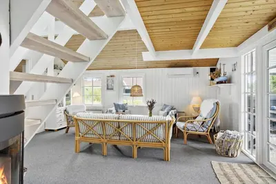 a living room with a table and chairs at 571-Thisted-Tunvej-21 in Thisted