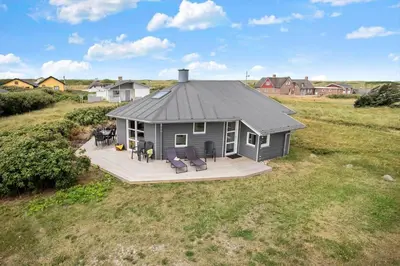a small house with a deck in a field at 189-Vestervig-Magevej-1-B in Vestervig