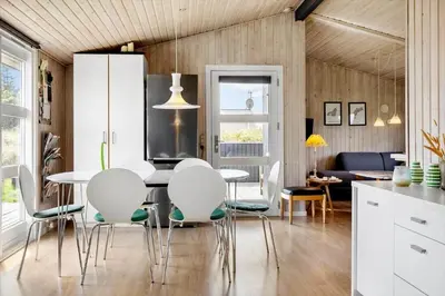 a kitchen and dining room with a table and chairs at 486-Thisted-Fiskervej-57 in Thisted