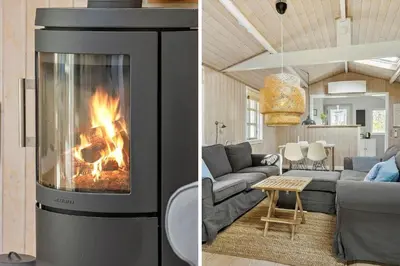 a living room with a fireplace and a couch at 788-Thisted-Blamunkevej-46 in Thisted