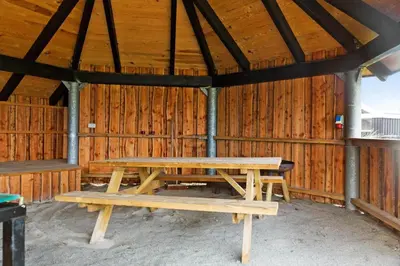 a wooden picnic table in a wooden barn at 896-Thisted-Fiskervej-81 in Thisted