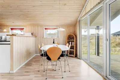 a kitchen and dining room with a table and chairs at 123-Thisted-Orredvej-30 in Thisted